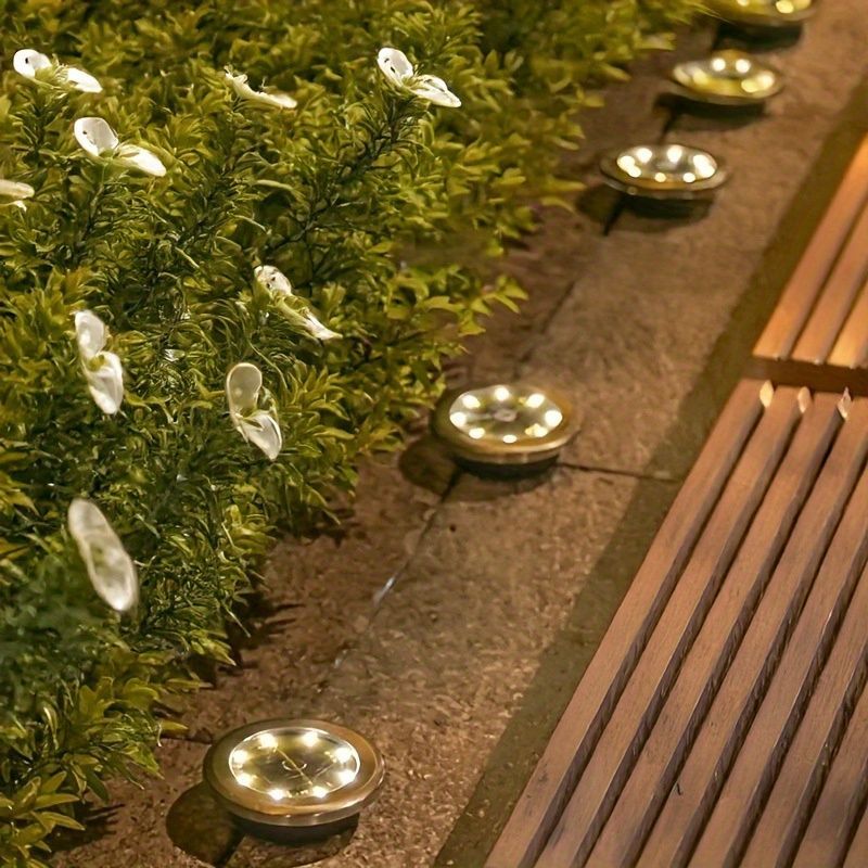 solar ground disk lights, outdoor lighting Australia, 8 LED lights, stainless steel solar lights, path lighting, garden driveway lights, courtyard lawn lighting, solar powered ground lights, energy efficient garden lights, automatic dusk to dawn lights -