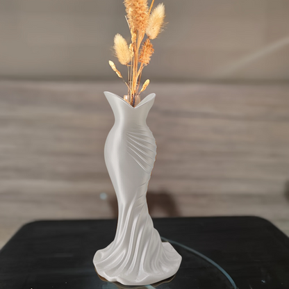 This elegant dress vase combines high-fashion elegance with minimalist home décor. Whether you insert real flowers into the glass tube or display artificial flowers without the tube, it is exceptionally beautiful.