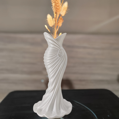 This elegant dress vase combines high-fashion elegance with minimalist home décor. Whether you insert real flowers into the glass tube or display artificial flowers without the tube, it is exceptionally beautiful.