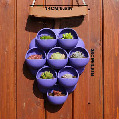 3D-printed grape pots in purple, brown, and green.