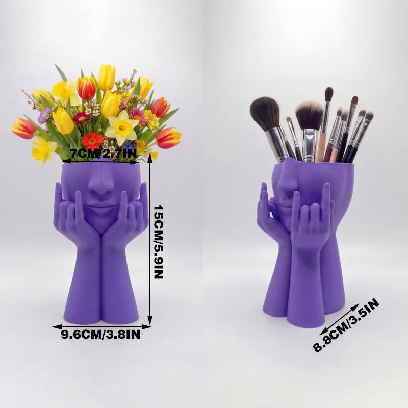 3D-printed rock face vase or office organizer, black.