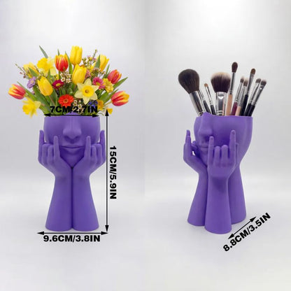 3D-printed rock face vase or office organizer, black.